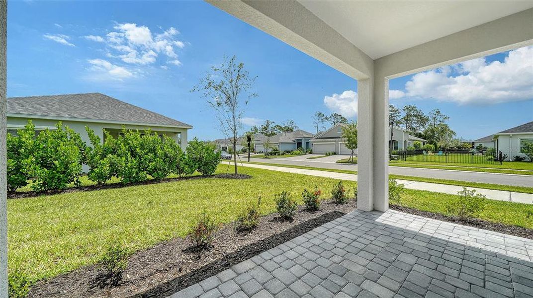 Exterior details and patio area of a home in Wildleaf at North River Ranch, Parrish (Image 19).