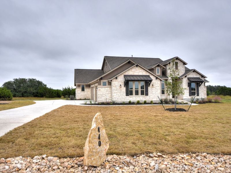 Representative exterior photo of a completed home built from the San Simeon I by Giddens Homes in Clearwater Ranch, Liberty Hill, TX (Image 45).