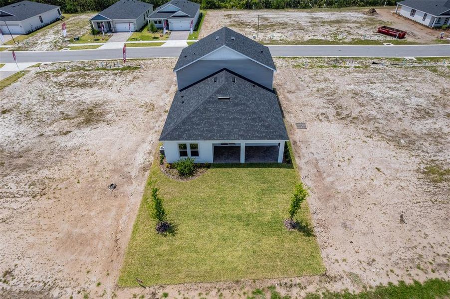 Front exterior of a new home in Gray Hawk at Hole Two, Daytona Beach, FL, highlighting curb appeal (Image 31). Front exterior of a new home in Gray Hawk at Hole Two, Daytona Beach, FL, highlighting curb appeal (Image 31).