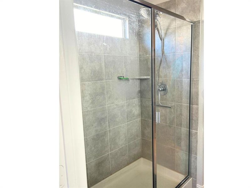 Bathroom featuring an enclosed shower