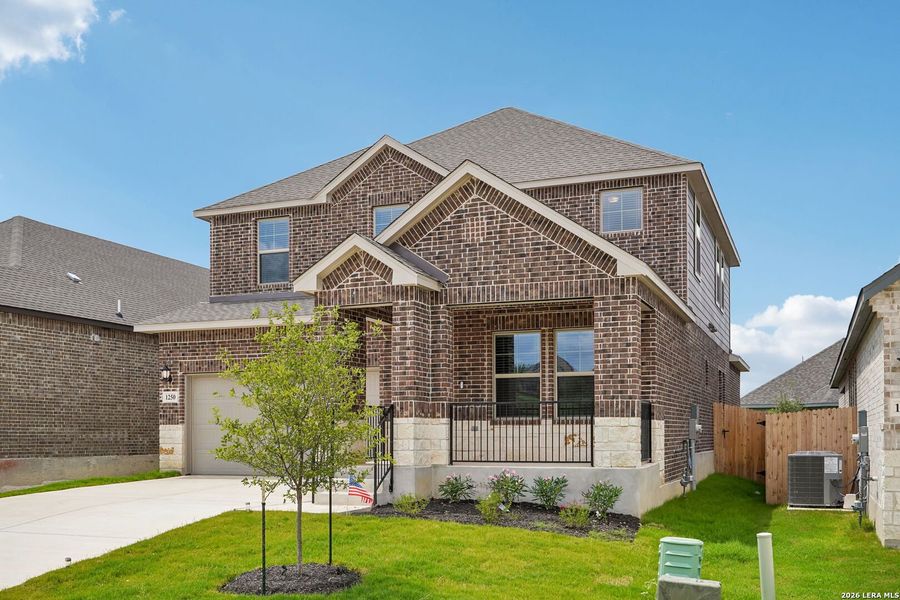 Front exterior of a new home in Arcadia Ridge - Premier Series, San Antonio, TX, highlighting curb appeal (Image 26).