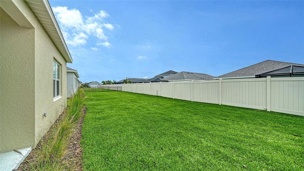 Exterior details and patio area of a home in Canoe Creek, Parrish (Image 24).