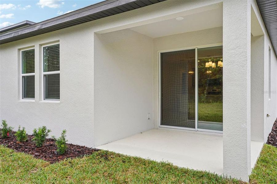 Exterior details and patio area of a home in Ridgehaven - Signature Series, Ormond Beach (Image 23).