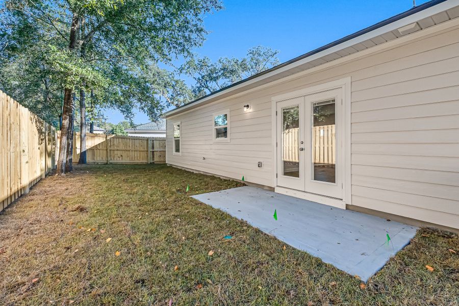 Exterior details and patio area of a home in Live Oak Cottages, Freeport (Image 23). Exterior details and patio area of a home in Live Oak Cottages, Freeport (Image 23).