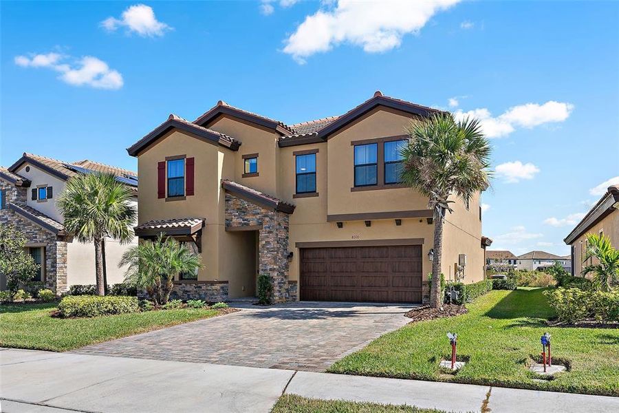 Front exterior of a new home in , Parrish, FL, highlighting curb appeal (Image 24).