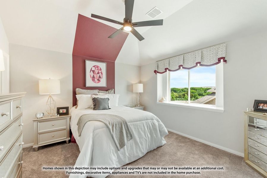 Bedroom with vaulted ceiling, red accent wall, ceiling fan, and carpet flooring