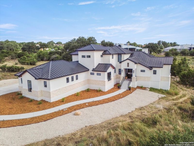 Front exterior of a new home in , New Braunfels, TX, highlighting curb appeal (Image 26). Front exterior of a new home in , New Braunfels, TX, highlighting curb appeal (Image 26).