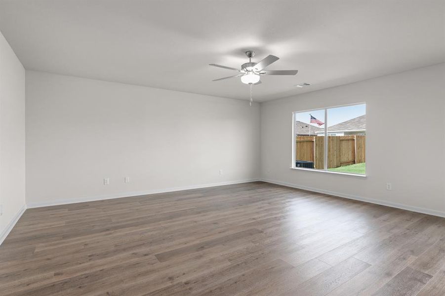 Unfurnished room with light wood-type flooring and ceiling fan Unfurnished room with light wood-type flooring and ceiling fan