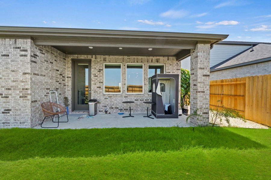 The covered back patio creates a shaded outdoor space overlooking the backyard and greenbelt. It adds an easy place for seating, grilling, or relaxing outside. The covered back patio creates a shaded outdoor space overlooking the backyard and greenbelt. It adds an easy place for seating, grilling, or relaxing outside.