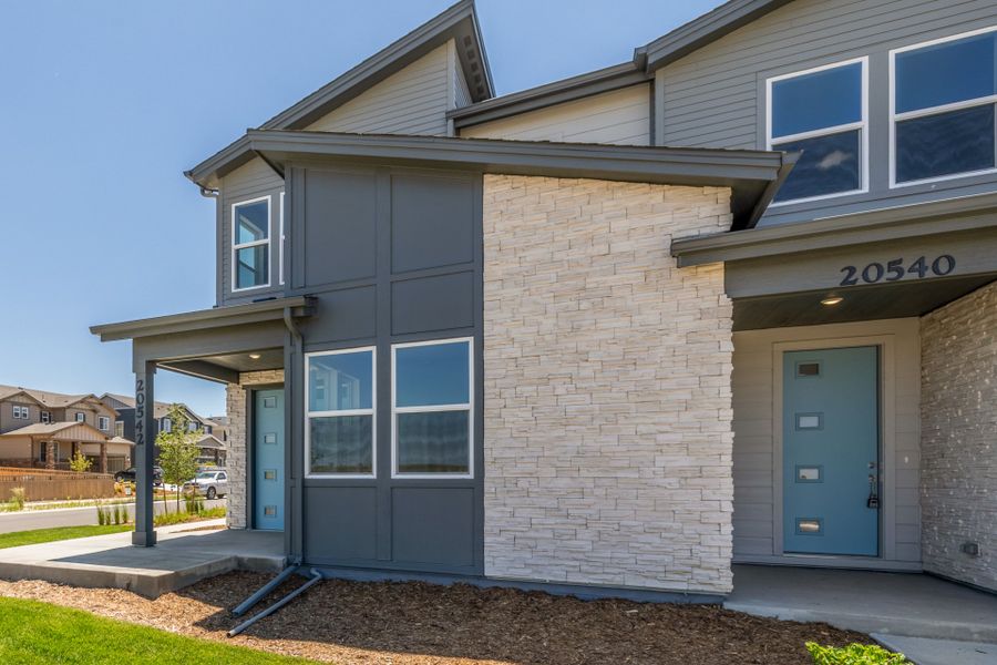 Front exterior of a new home in Painted Prairie, Aurora, CO, highlighting curb appeal (Image 19).