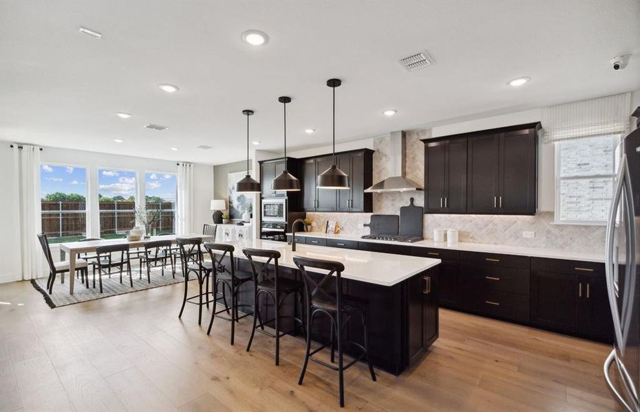 Kitchen featuring a large island ideal for informal dining and gatherings *Model representation Kitchen featuring a large island ideal for informal dining and gatherings *Model representation