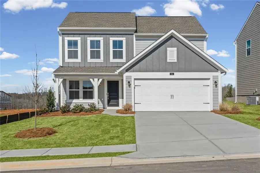 Front exterior of a new home in Twin Lakes, Hoschton, GA, highlighting curb appeal (Image 1). Front exterior of a new home in Twin Lakes, Hoschton, GA, highlighting curb appeal (Image 1).