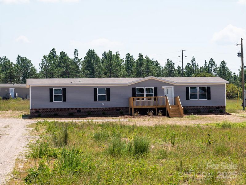 Front exterior of a new home in , Mount Croghan, SC, highlighting curb appeal (Image 14).