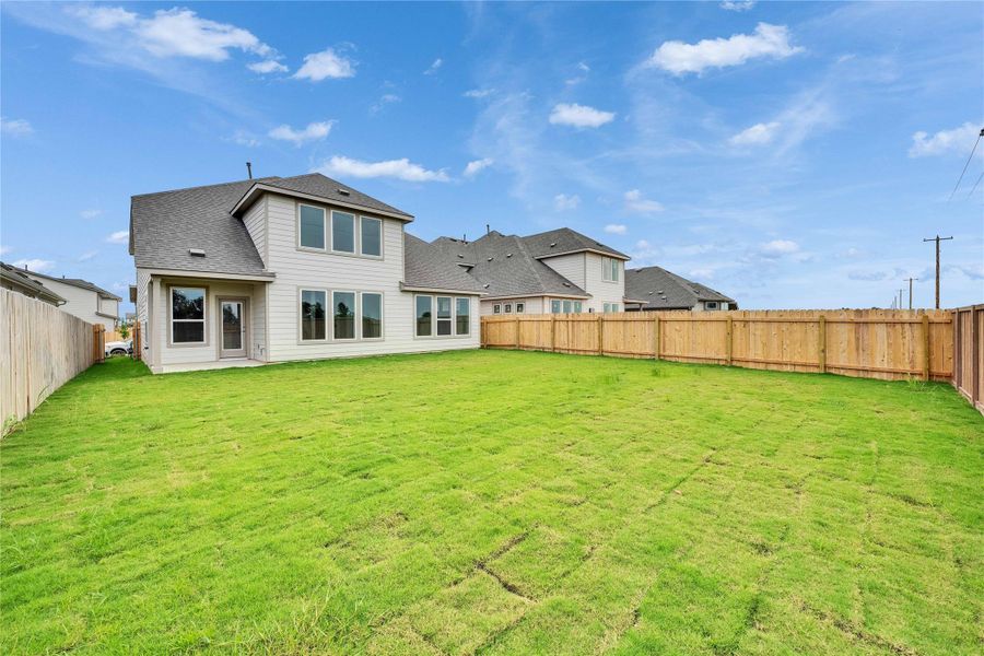 Rear view of property featuring roof with shingles Rear view of property featuring roof with shingles
