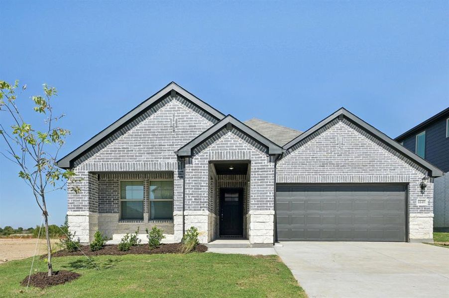 Front exterior of a new home in Tesoro at Chisholm Trail Ranch, Fort Worth, TX, highlighting curb appeal (Image 1).