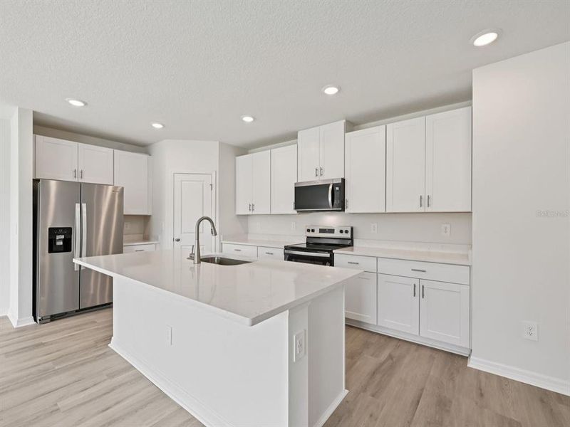 Furnished interior view inside a new home in The Reserve at Van Oaks, Auburndale (Image 4).