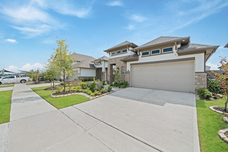 Front exterior of a new home in , Cypress, TX, highlighting curb appeal (Image 27).