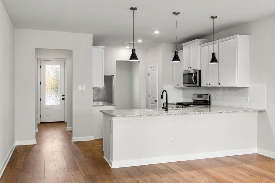 Furnished interior view inside a new home in Sunterra, Katy (Image 4).