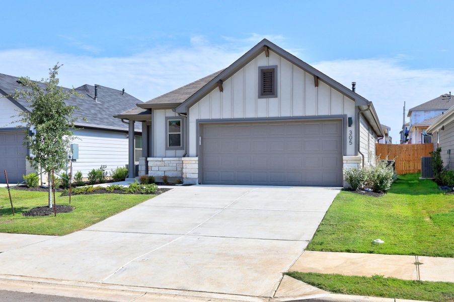 Front exterior of a new home in Trinity Ranch, Elgin, TX, highlighting curb appeal (Image 20).