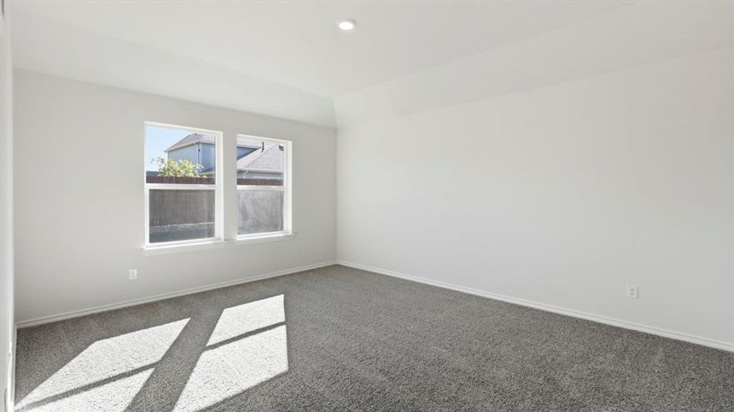 Carpeted empty room with baseboards Carpeted empty room with baseboards