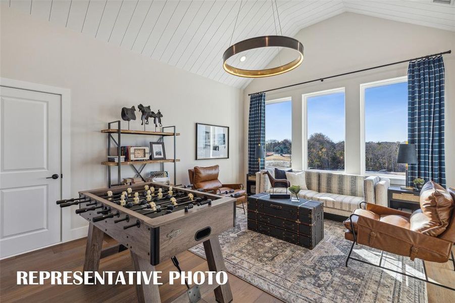 The entire family will enjoy hours of fun time in this spacious, light filled game room!  REPRESENTATIVE PHOTO