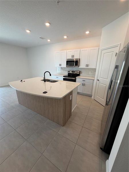 Furnished interior view inside a new home in The Townhomes at Anthem Park, St. Cloud (Image 4).