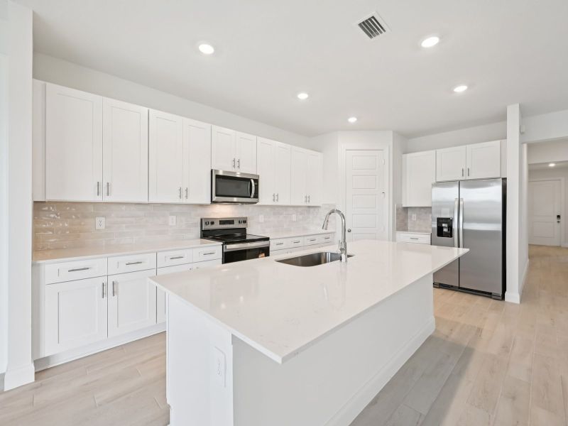 Furnished interior view inside a new home in Brystol at Wylder - Reserve Series, Port St. Lucie (Image 7).