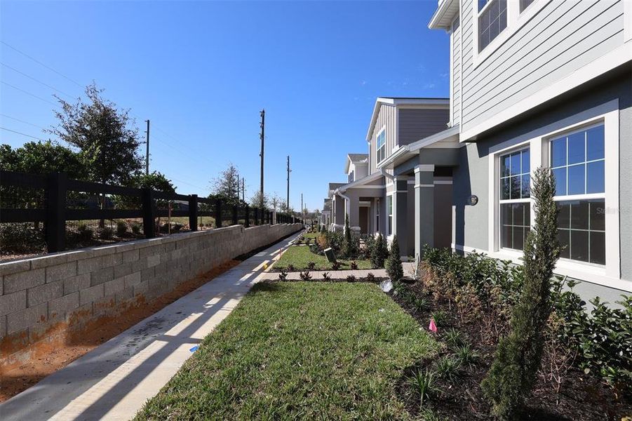 Exterior details and patio area of a home in Lake Star at Ovation, Winter Garden (Image 3).