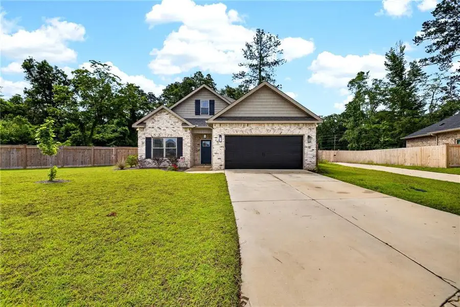Front exterior of a new home in , Kathleen, GA, highlighting curb appeal (Image 1). Front exterior of a new home in , Kathleen, GA, highlighting curb appeal (Image 1).