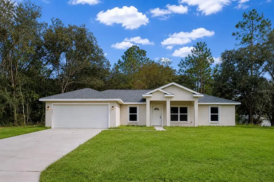 Front exterior of a new home in , Citrus Springs, FL, highlighting curb appeal (Image 1). Front exterior of a new home in , Citrus Springs, FL, highlighting curb appeal (Image 1).