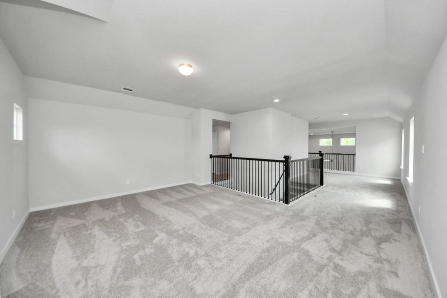 Ascend to relaxation in this fantastic game room! Ideal for both casual gatherings and adult gaming, it boasts plush carpet, lofty ceilings, custom paint, and ample windows for abundant natural light Ascend to relaxation in this fantastic game room! Ideal for both casual gatherings and adult gaming, it boasts plush carpet, lofty ceilings, custom paint, and ample windows for abundant natural light