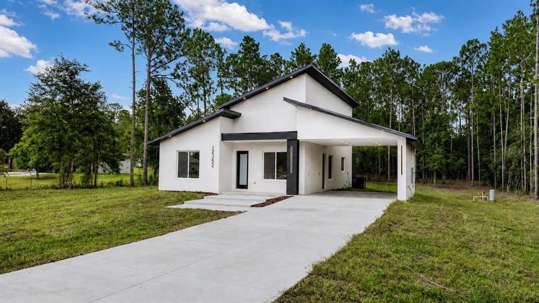 Front exterior of a new home in , Ocala, FL, highlighting curb appeal (Image 22).
