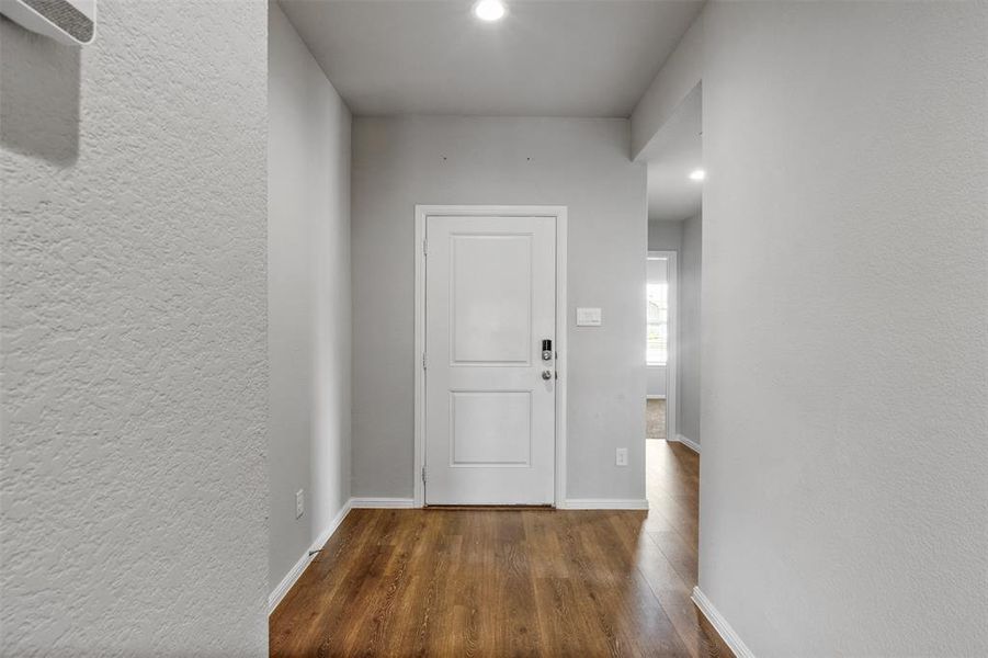 Hall featuring dark hardwood / wood-style flooring