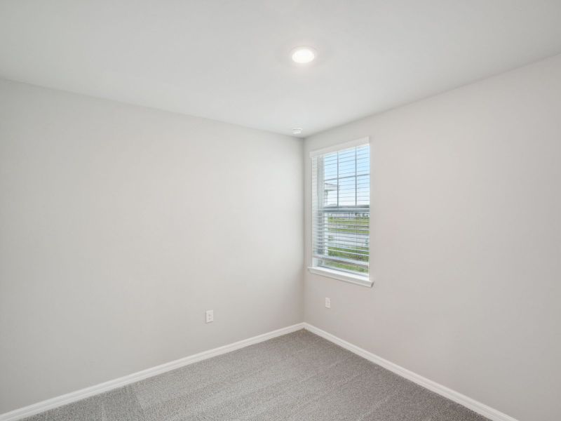 Spacious, unfurnished interior of a new home in Crescent Lakes - Premier Series, Punta Gorda (Image 13).