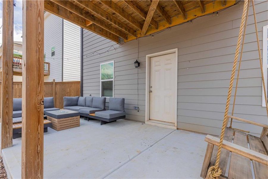 Exterior details and patio area of a home in Creekside at Farmers Crossing, Ball Ground (Image 25).
