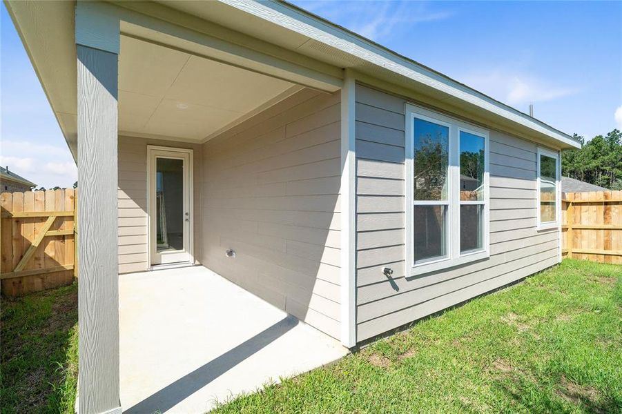 Come and see this spacious backyard with its beautiful covered patio. There is plenty of room for the kids to play and adults to relax!