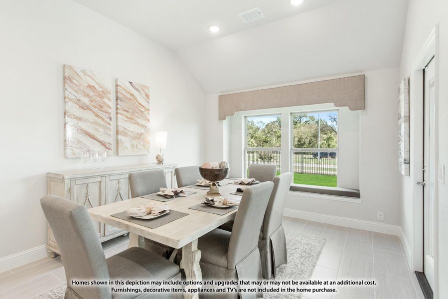 Dining room with rectangular table, six gray chairs, window seat, and backyard view Dining room with rectangular table, six gray chairs, window seat, and backyard view