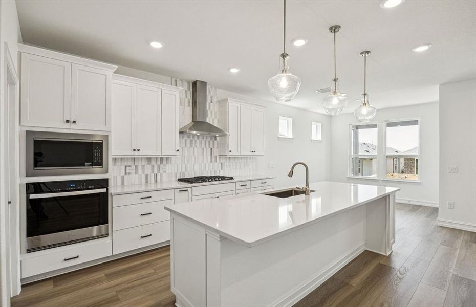 Kitchen featuring a large island ideal for informal dining and gatherings *Real home pictured Kitchen featuring a large island ideal for informal dining and gatherings *Real home pictured