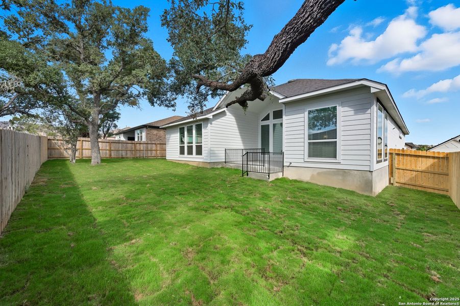 Exterior details and patio area of a home in The Reserve at Potranco Oaks, Castroville (Image 4).