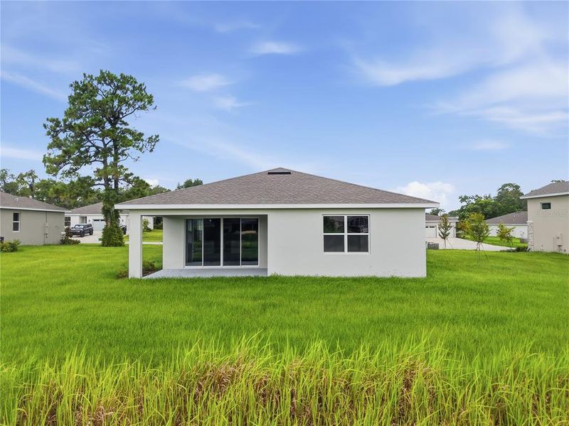 Exterior details and patio area of a home in Glen Lakes, Weeki Wachee (Image 22).