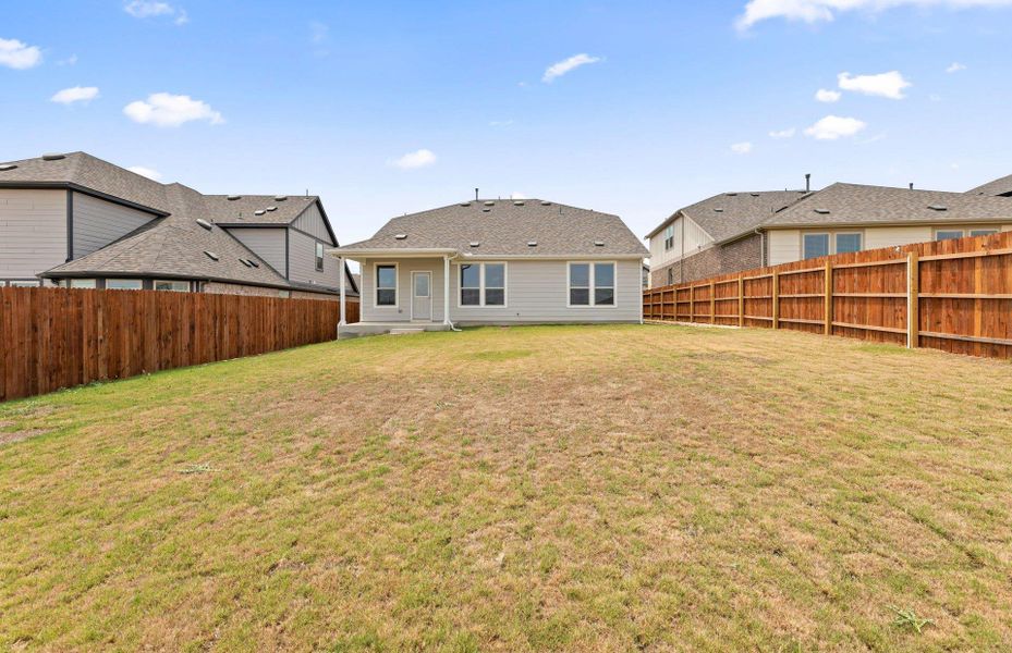 Exterior details and patio area of a home in Saddleback at Santa Rita Ranch, Liberty Hill (Image 21).