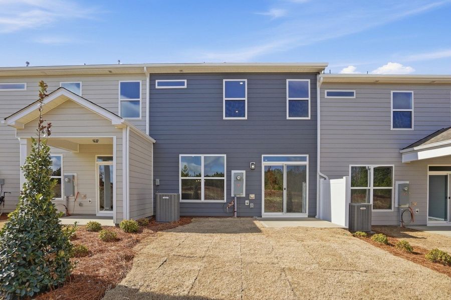 Exterior details and patio area of a home in Blythe Mill Townhomes, Waxhaw (Image 3). Exterior details and patio area of a home in Blythe Mill Townhomes, Waxhaw (Image 3).