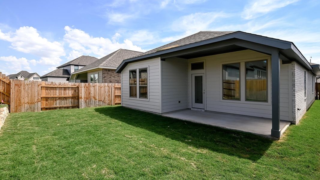 Exterior details and patio area of a home in Crosswinds 40', Kyle (Image 3).