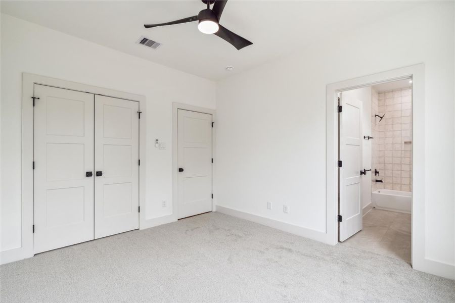 Complete with its own ensuite bath, this secondary bedroom offers a perfect retreat for guests or family alike.