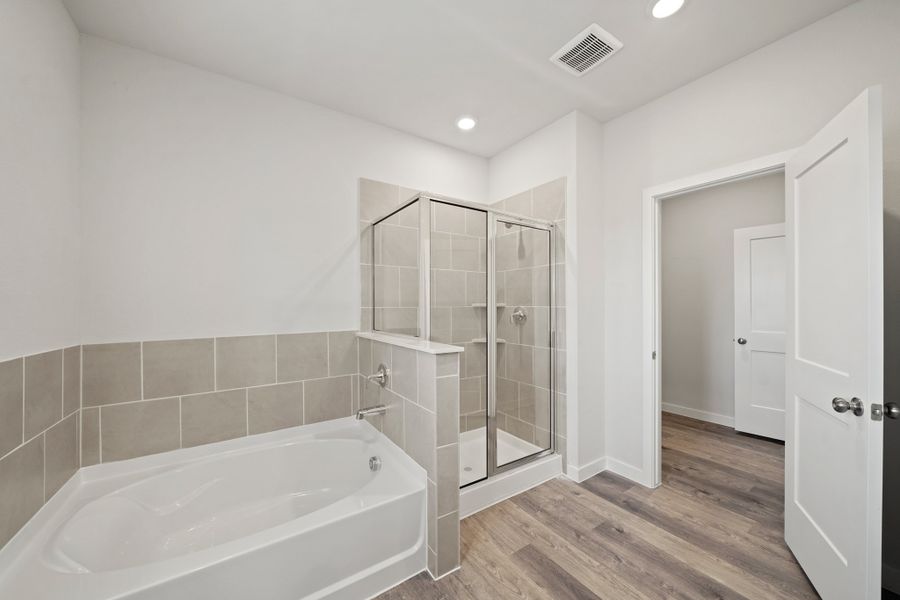 A bathroom with a glass shower. A bathroom with a glass shower.