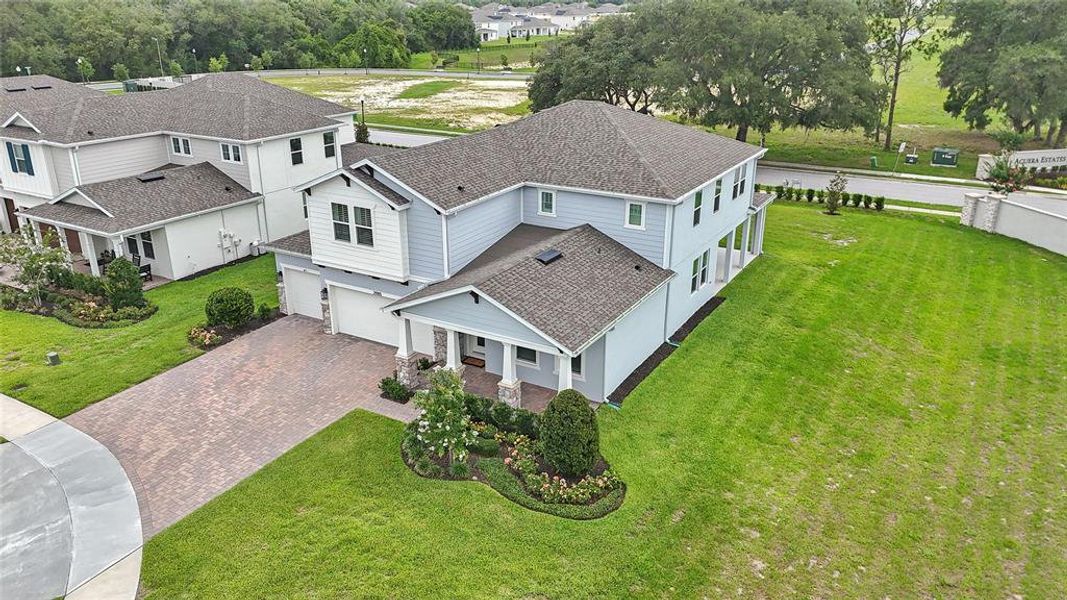 Front exterior of a new home in Acuera Estates, Apopka, FL, highlighting curb appeal (Image 31). Front exterior of a new home in Acuera Estates, Apopka, FL, highlighting curb appeal (Image 31).