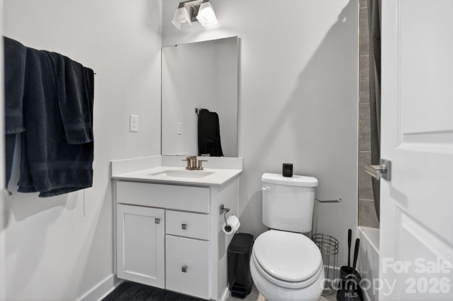 Full bathroom with tub and tile shower