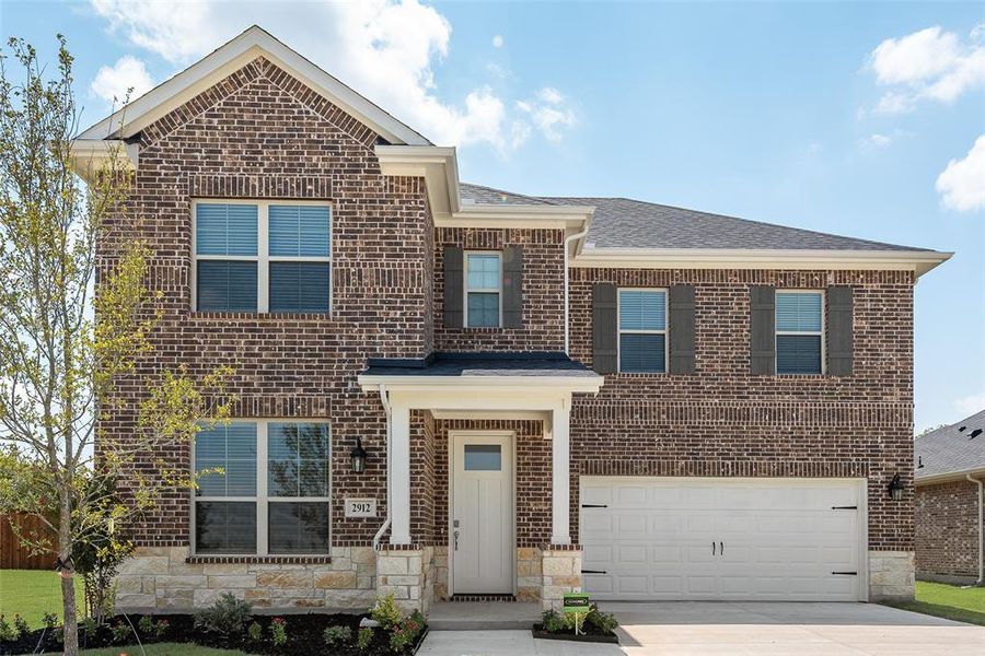 Front exterior of a new home in Walden Pond, Forney, TX, highlighting curb appeal (Image 19). Front exterior of a new home in Walden Pond, Forney, TX, highlighting curb appeal (Image 19).