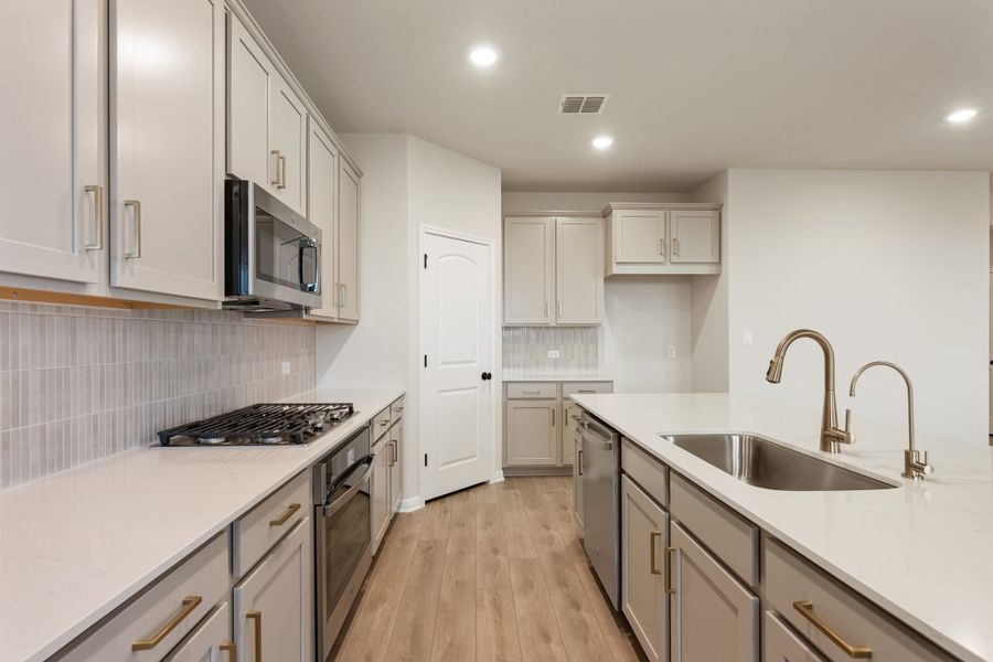 Representative furnished interior of a home built from the Lancaster by Ashton Woods in Berry Creek Highlands, Georgetown (Image 7).