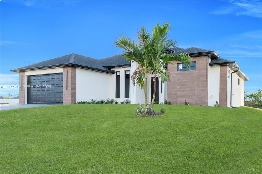 Front exterior of a new home in , Cape Coral, FL, highlighting curb appeal (Image 26).
